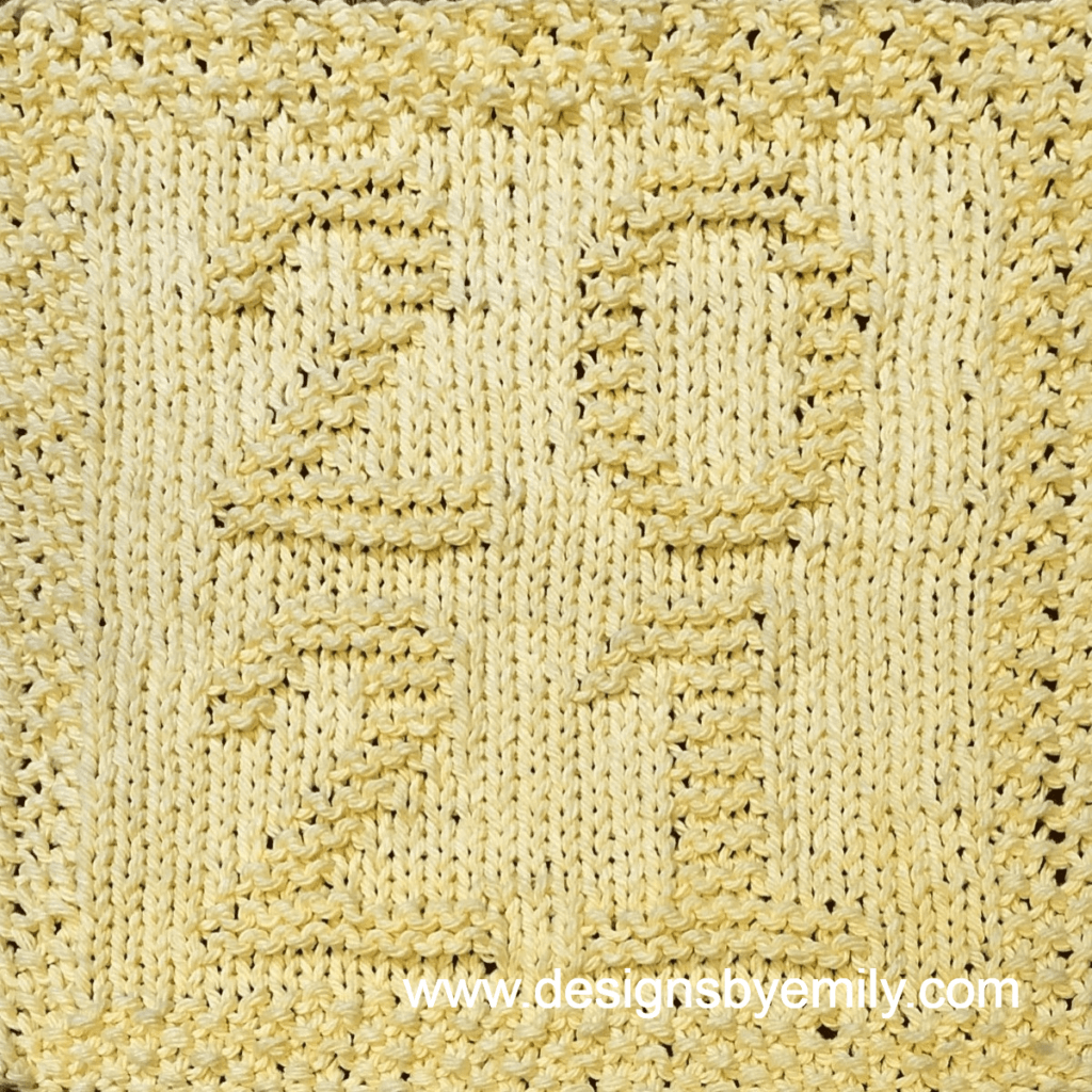 2021 Knit Dishcloth: A handmade knitted dishcloth square in yellow yarn with the numbers 2021 arranged in a square with 20 on top and 21 underneath. The design is created using knit and purl stitches.