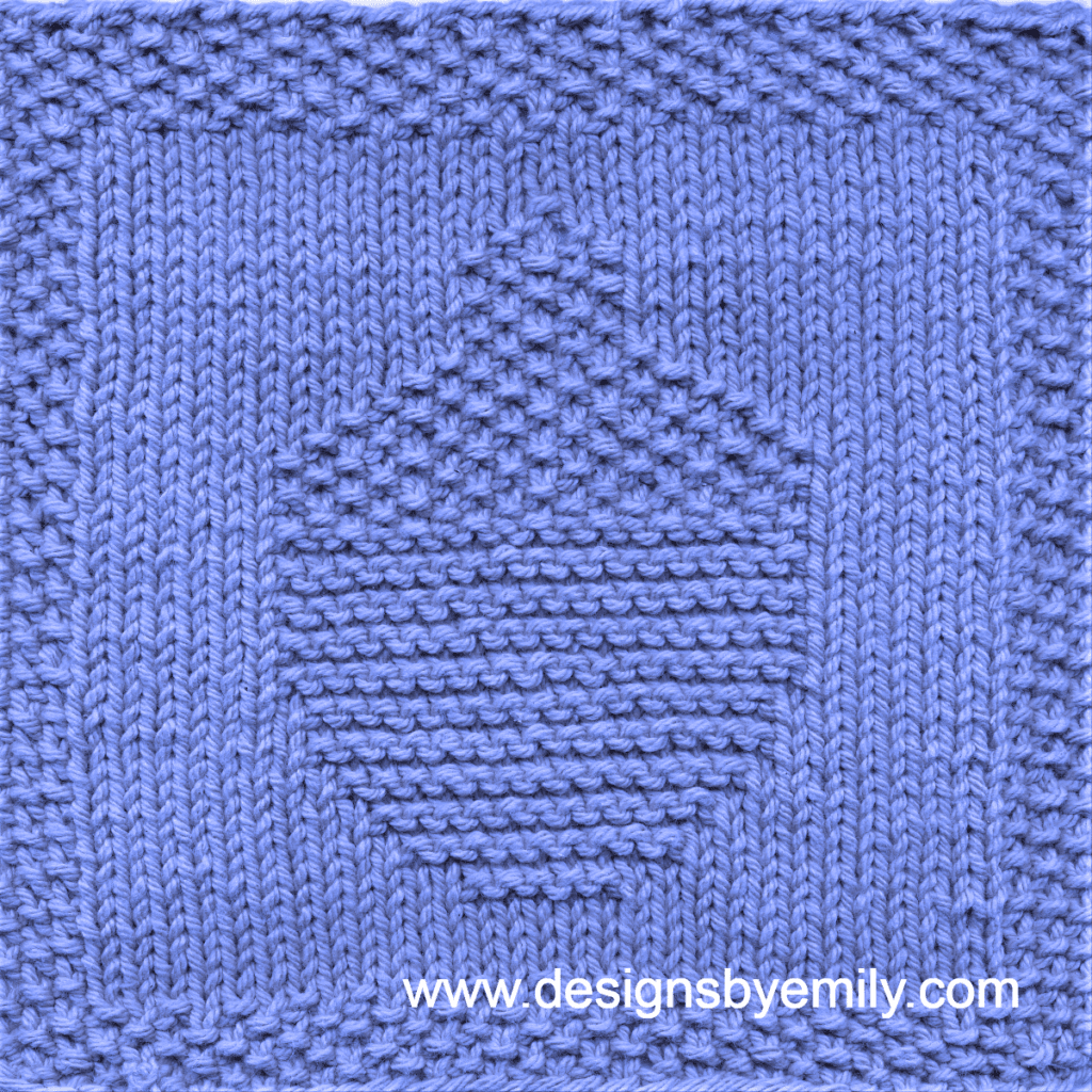 Acorn Knit Dishcloth: A handmade knitted dishcloth square in blue yarn featuring an acorn. The design is created using knit and purl stitches.