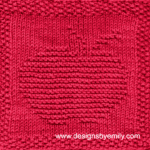 Apple Knit Dishcloth: A vibrant red knitted dishcloth square featuring a charming apple design, perfect for brightening up any kitchen space. The design is created using knit and purl stitches.