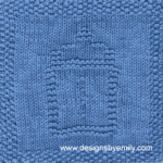 Baby Bottle Knit Dishcloth: A handmade knitted dishcloth square in blue yarn displaying a design of a baby bottle in the center. The design is created in garter stitch using knit and purl stitches on a stockinette background.