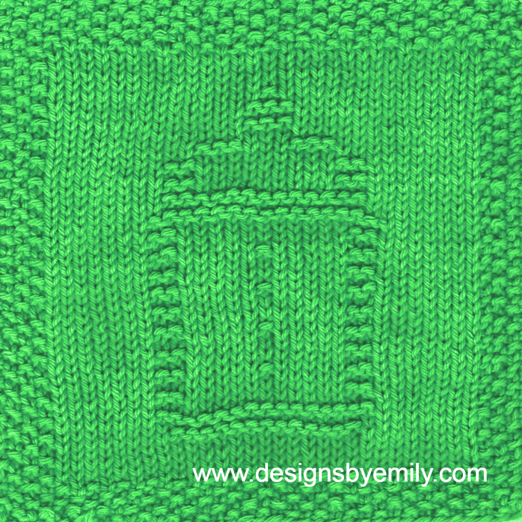 Baby Bottle Knit Dishcloth: A handmade knitted dishcloth square in green yarn displaying a design of a baby bottle in the center. The design is created in garter stitch using knit and purl stitches on a stockinette background.