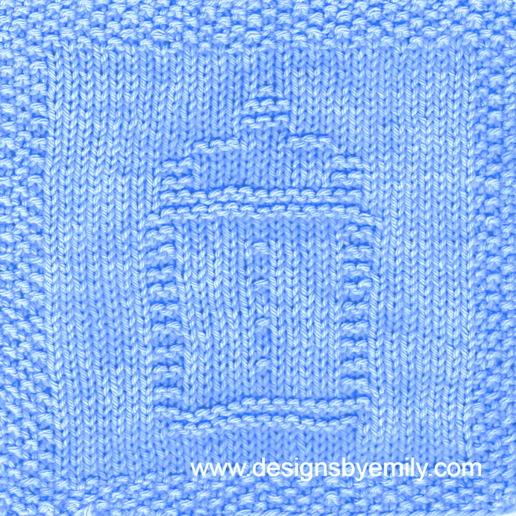 Baby Bottle Knit Dishcloth: A handmade knitted dishcloth square in light blue yarn displaying a design of a baby bottle in the center. The design is created in garter stitch using knit and purl stitches on a stockinette background.