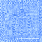 Baby Bottle Knit Dishcloth: A handmade knitted dishcloth square in light blue yarn displaying a design of a baby bottle in the center. The design is created in garter stitch using knit and purl stitches on a stockinette background.