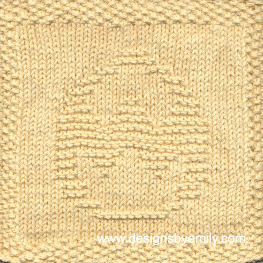 Easter Egg with Rickrack Knit Dishcloth: A handmade knitted dishcloth square in yellow yarn displaying an Easter egg decorated with zig-zag rickrack. The design is created in garter stitch using knit and purl stitches on a stockinette background.