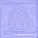 Easter Egg with Rickrack Knit Dishcloth: A handmade knitted dishcloth square in lilac yarn displaying an Easter egg decorated with zig-zag rickrack. The design is created in garter stitch using knit and purl stitches on a stockinette background.