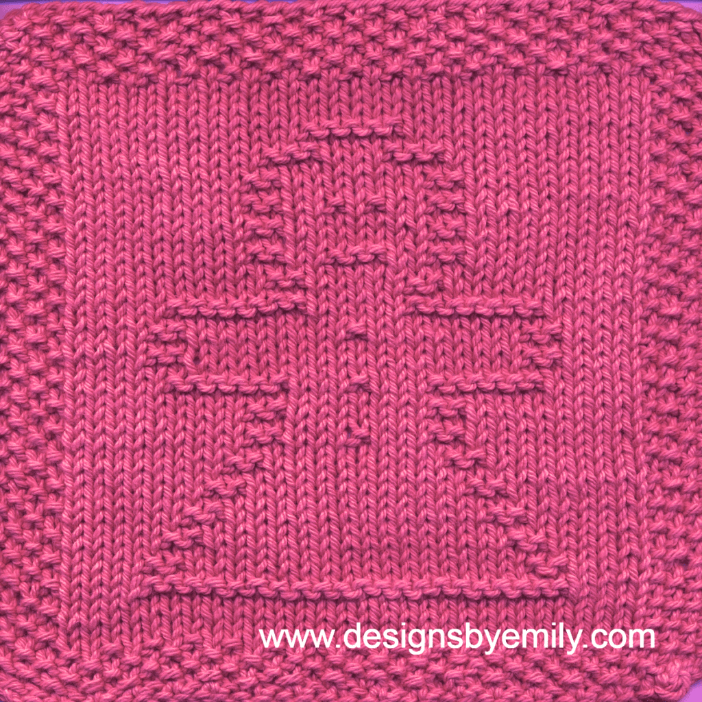 Gingerbread Girl Knit Dishcloth: A cozy knitted dishcloth square in pink yarn featuring a cheerful gingerbread girl in the center, perfect for holiday decor. The design is created in garter stitch using knit and purl stitches on a stockinette background.