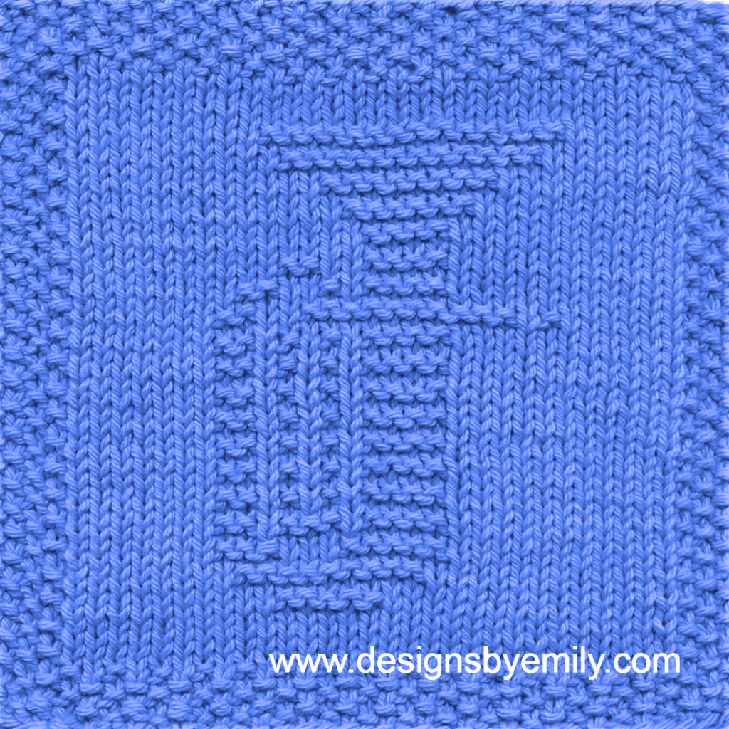 Baritone or Tuba Knit Dishcloth: A handmade knitted dishcloth square in blue yarn displaying a tuba or baritone musical instrument. The design is created in garter stitch using knit and purl stitches on a stockinette background.