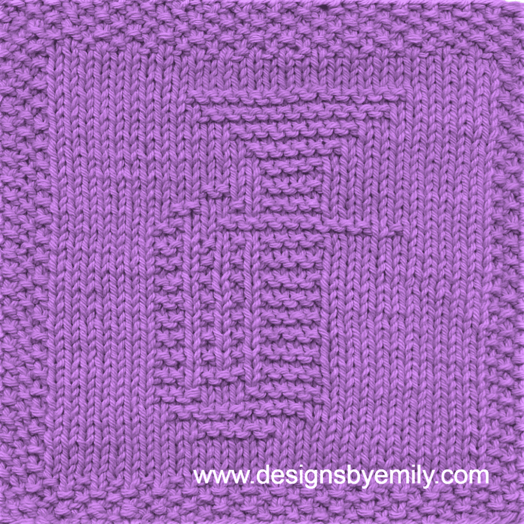 Baritone or Tuba Knit Dishcloth: A handmade knitted dishcloth square in light purple yarn displaying a tuba or baritone musical instrument. The design is created in garter stitch using knit and purl stitches on a stockinette background.