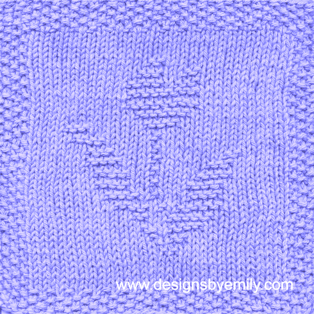 Tulip Knit Dishcloth: A handmade knitted dishcloth square in lilac yarn displaying a single tulip with its distinctive leaves to each side. The design is created using knit and purl stitches.