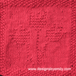 Tulip Trio Knit Dishcloth: A handmade knitted dishcloth square in red yarn displaying three tulips sprouting from the center. The design is created using knit and purl stitches.